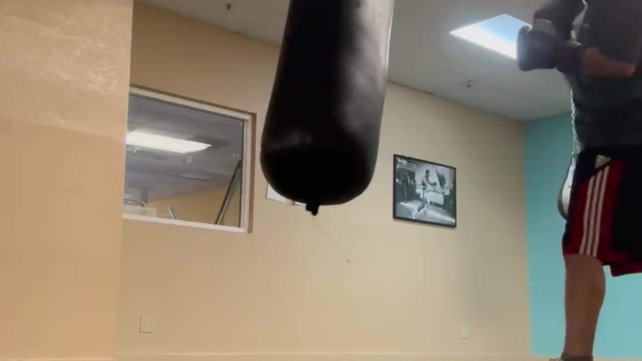 Training punching combination on heavy bag