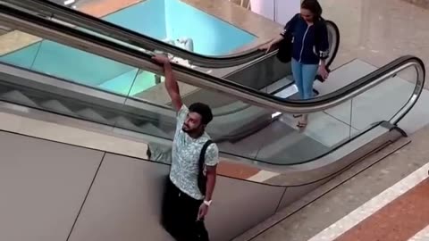 Man Hold On Escalator