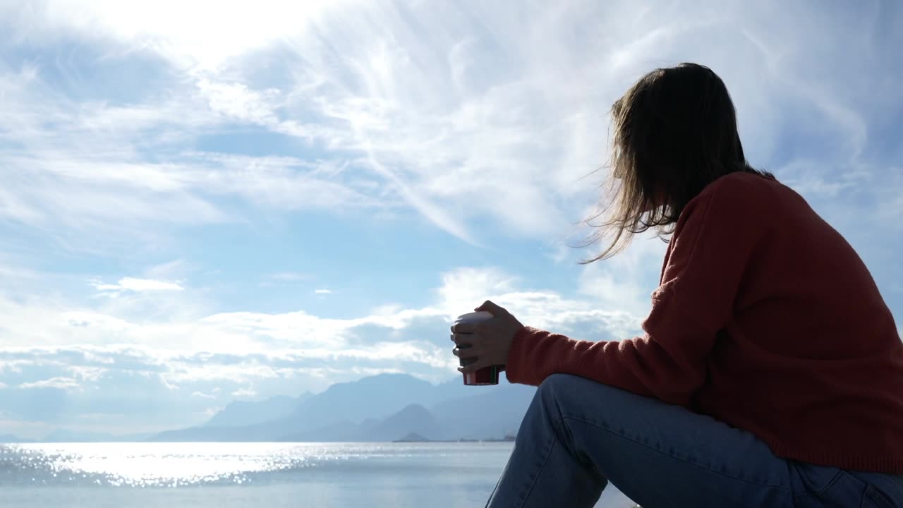 Guy Looking at Sea Horizon Drinking Coffee [Free Stock Video Footage Clips]