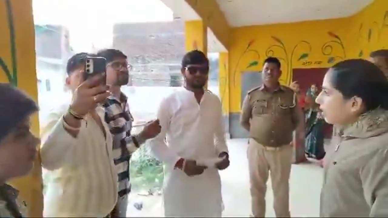 Woman police - why are you entering inside and doing fake voting