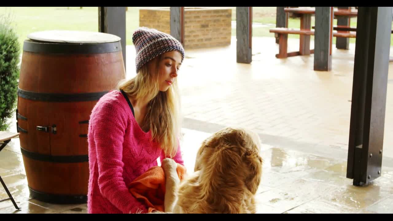 Woman with her dogs at home