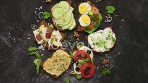 Assortment of home made sandwiches with various toppings With colorful fresh vegetables-Assortment o