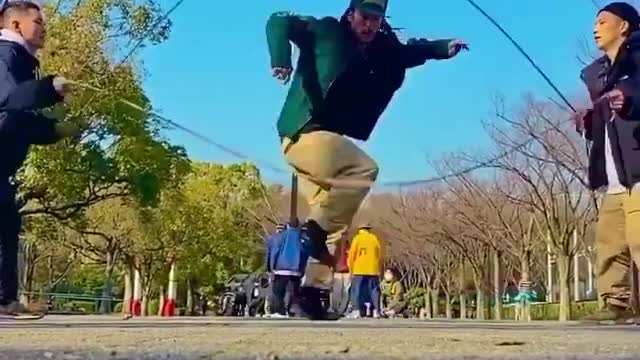 Guy Shows Amazing Dance Moves While Rope Jumping With Two Cables