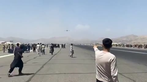 Afghanistan: Three people fall from plane as thousands attempt to flee Kabul at any cost