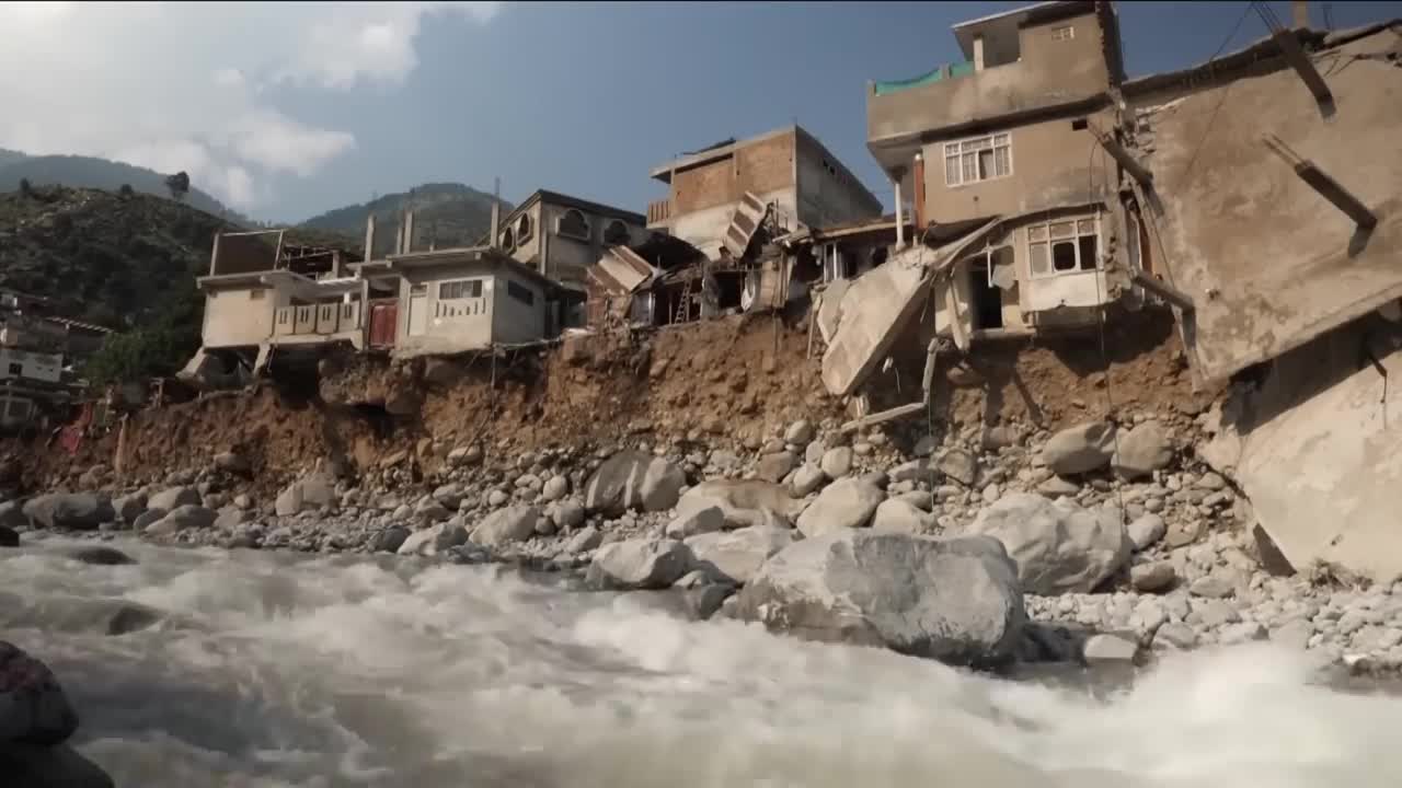 Pakistan floods: Men trek 20 miles from cut-off town to get food for their stranded families