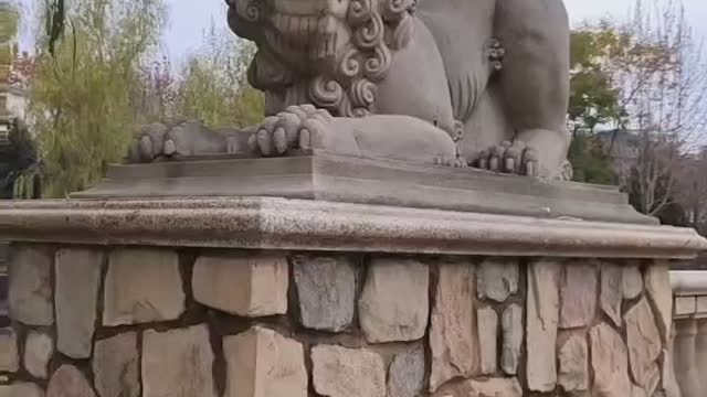 Stone Lion on Stone Pier