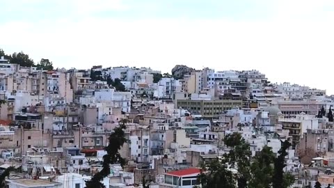 A look out over Athens Greece at sunset.