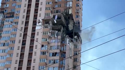 Moment rocket strikes Kyiv apartment block