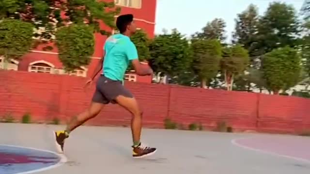 Guy Performs Amazing Basketball Shot While Jumping Over a Bowl Of Water