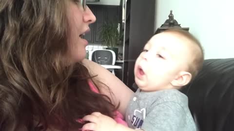 Baby reacts to mother