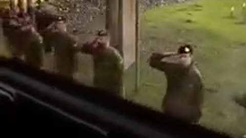 British soldiers salute Ukrainians, who have completed their training