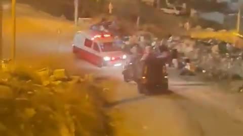 Israeli military vehicle intentionally obstructing a Palestinian ambulance