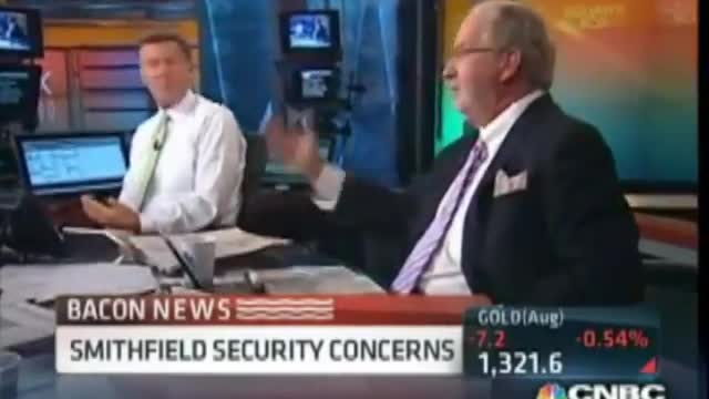 CNBC news anchor "hisses"(reptilian) at a guest. Then try to correct himself.