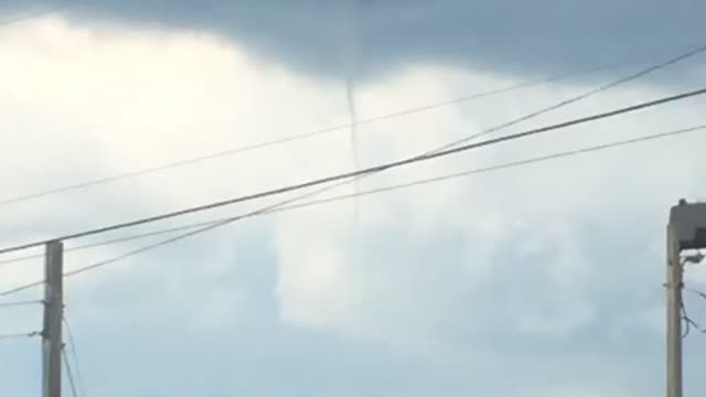 Small tornado on sunny day