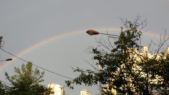 A rainbow appeared in the dry sky.