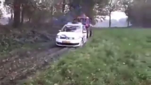 Dutch farmers tow away the unwanted police vehicles