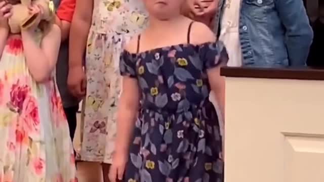 Little girl breaks out the dance Moves during a concert in their