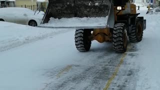 Snow cleaning on the street in winter.