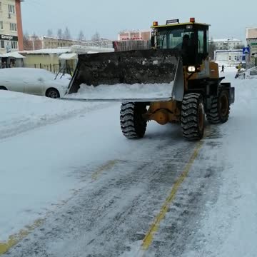 Snow cleaning on the street in winter.