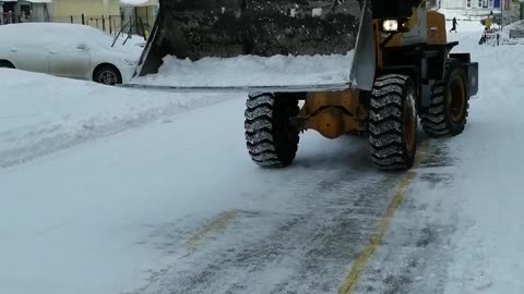 Snow cleaning on the street in winter.