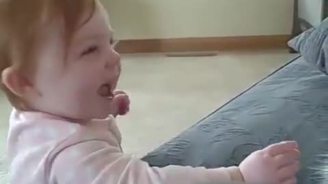 Baby and her cat boxing