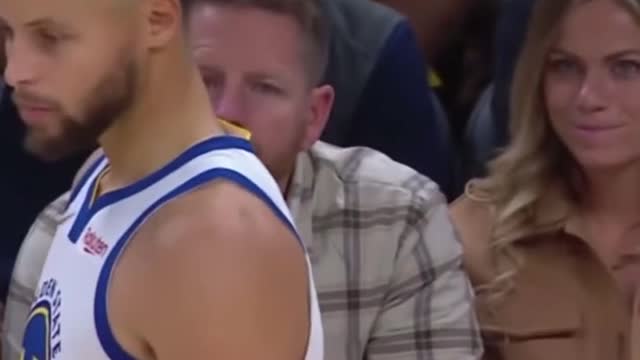 Women courtside bit lips after Stephen Curry looked at her