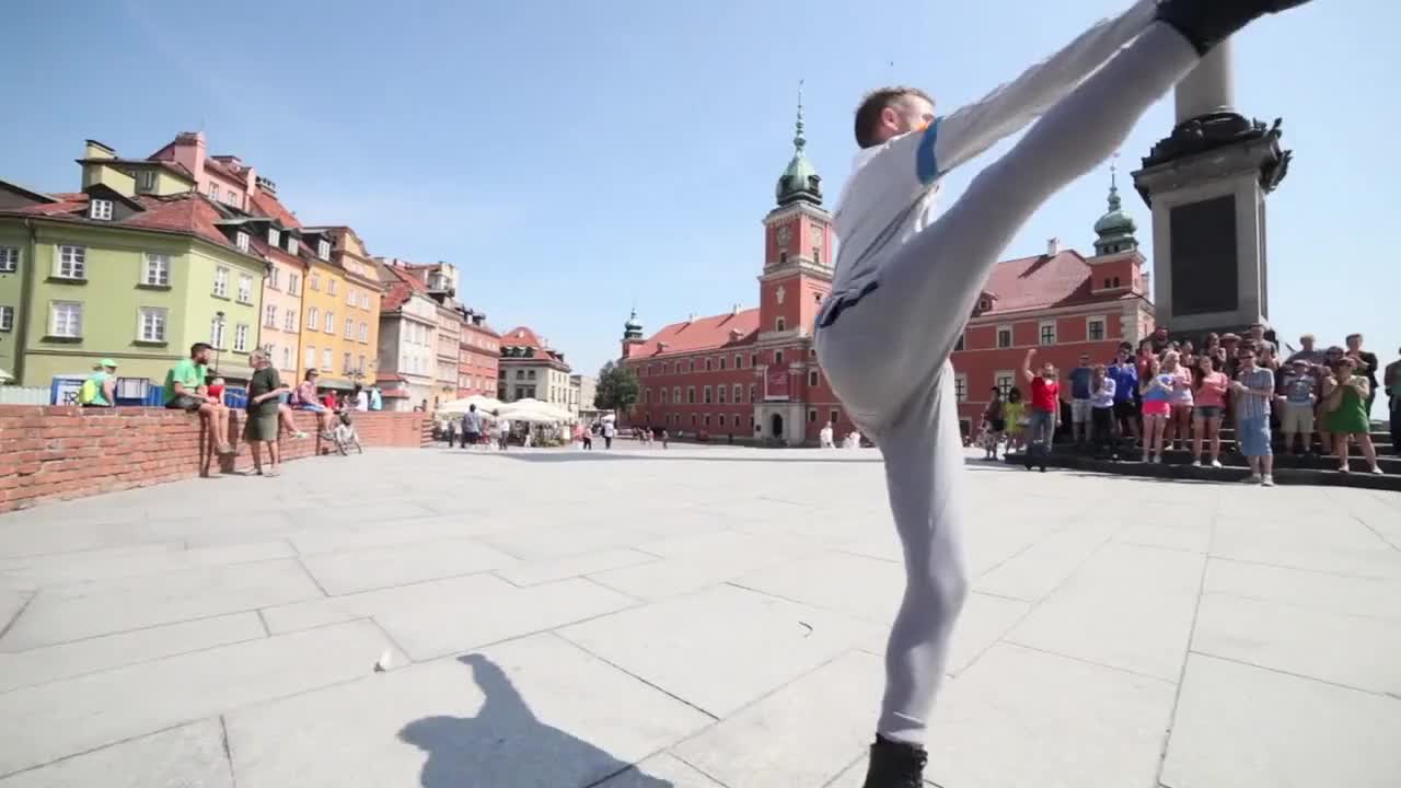 Man in Roller Blades Performing Infront of the People