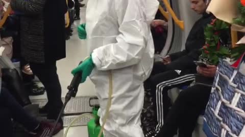 Woman in white hazmat outfit black boots