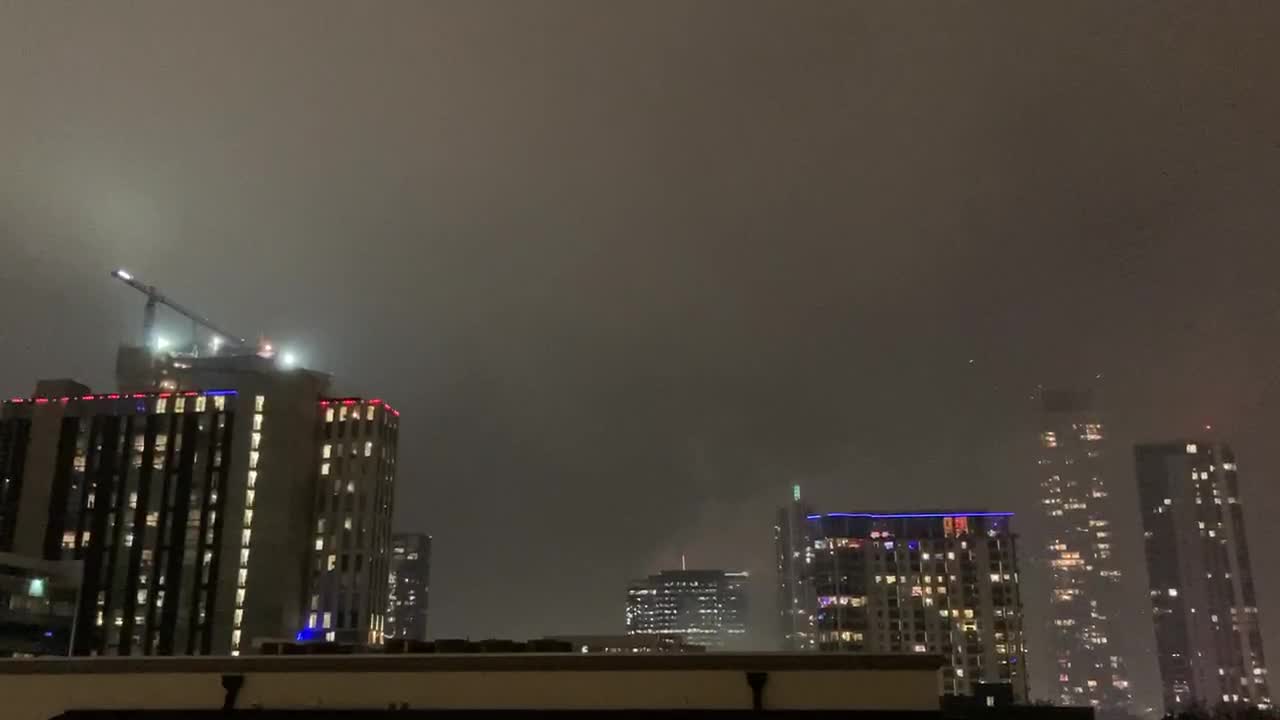 New Year’s Eve fireworks over the Colorado River in Austin with a floating 2