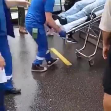 People Still Wait in Line for Vax, While an Injected Person Gets Taken Away via Ambulance