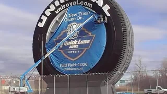 Quicklane Bowl Banner on the Uniroyal Giant Tire