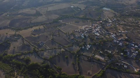 Village surrounded by fields seen from the air