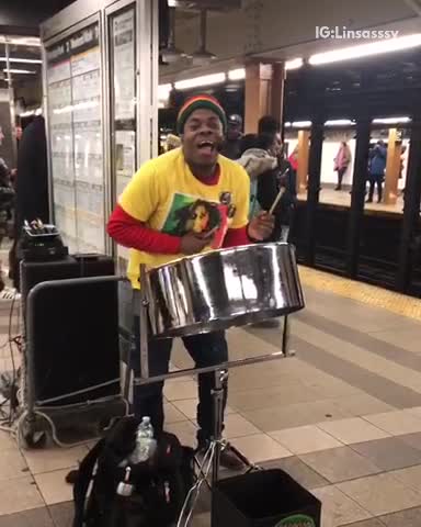 Man sings "could you be loved" bob marley at subway station, playing jamaican steel drum