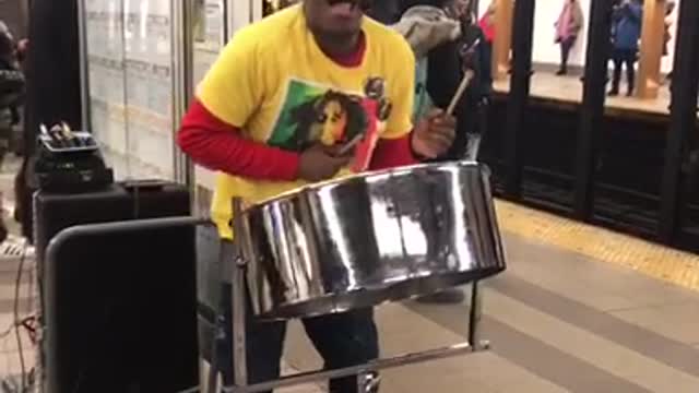 Man sings "could you be loved" bob marley at subway station, playing jamaican steel drum