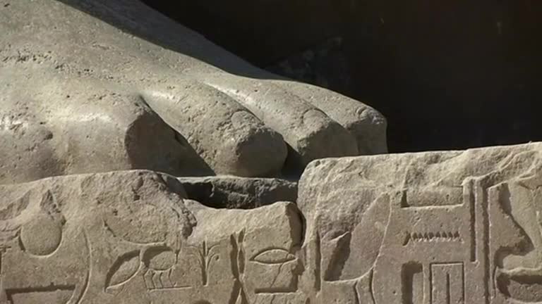 Ancient Pharaoh colossus towers again, after centuries under water