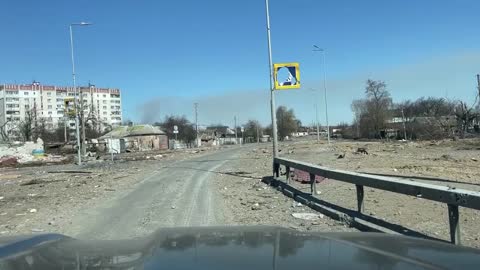 Russian forces distributing humanitarian supplies near Kiev.