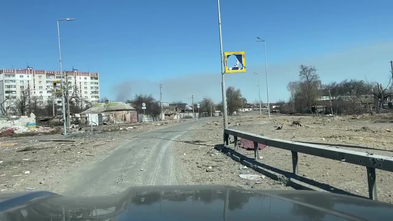 Russian forces distributing humanitarian supplies near Kiev.