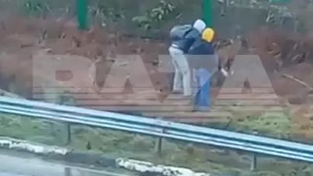 At first it may seem that these two guys in Sochi are looking for a bookmark.