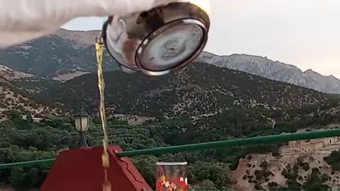 Pouring tea in a beautiful landscape