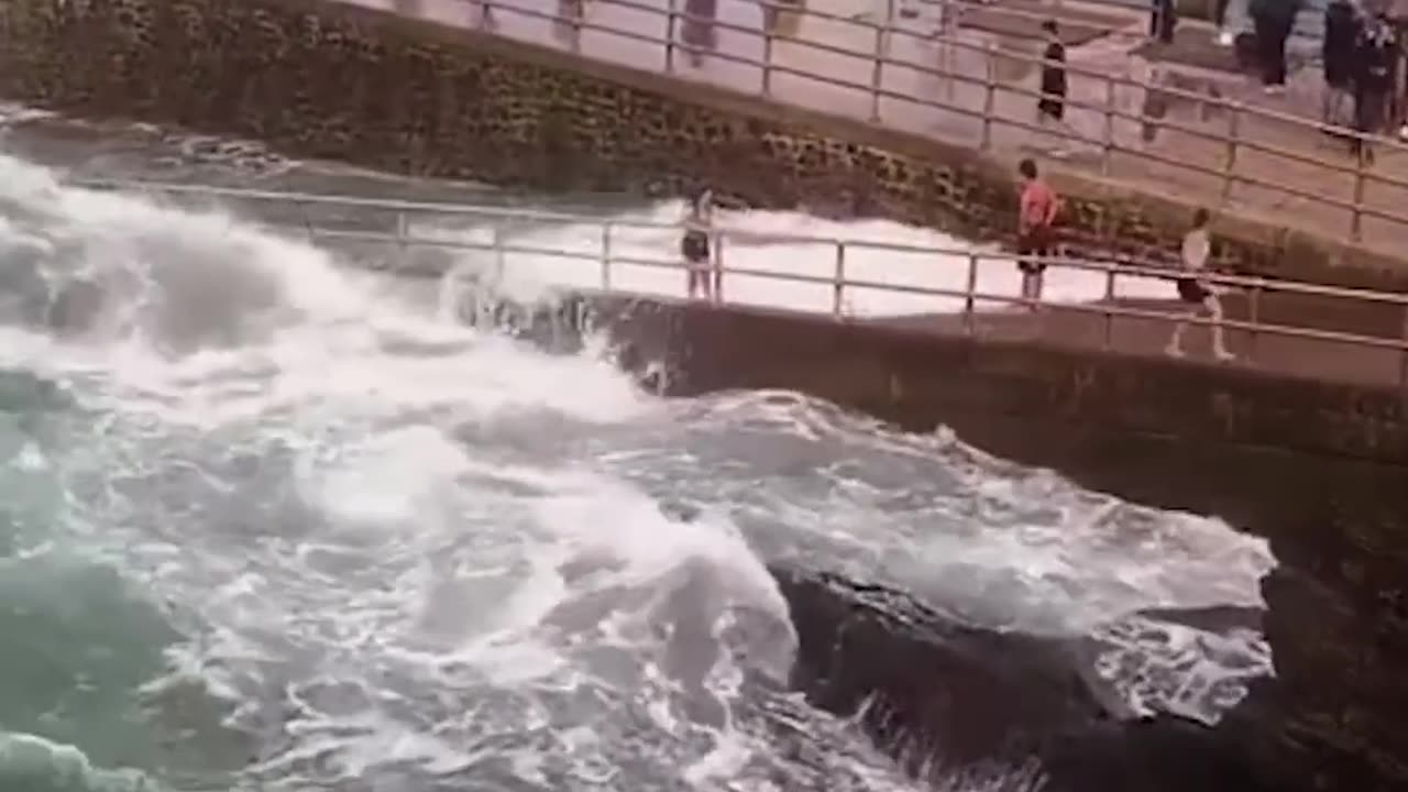 Little Girl Rescued After Wave Knocks Her Off a Pier #shorts
