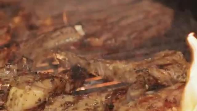 Sizzling Meat on Barbecue Close Up Slow Motion Video