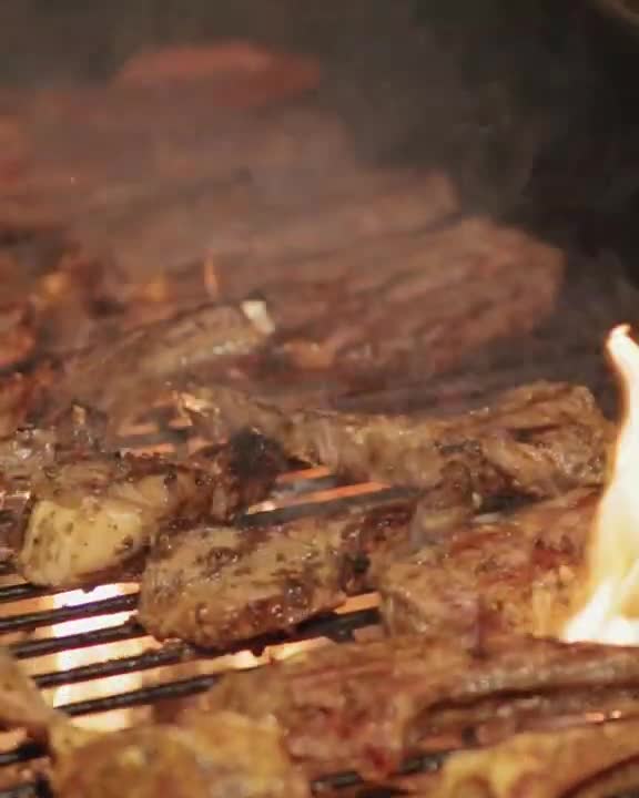 Sizzling Meat on Barbecue Close Up Slow Motion Video