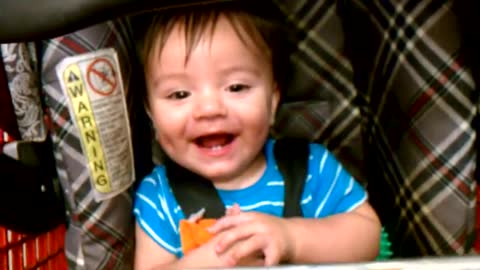 Baby is laughing at Lowe's supermarket
