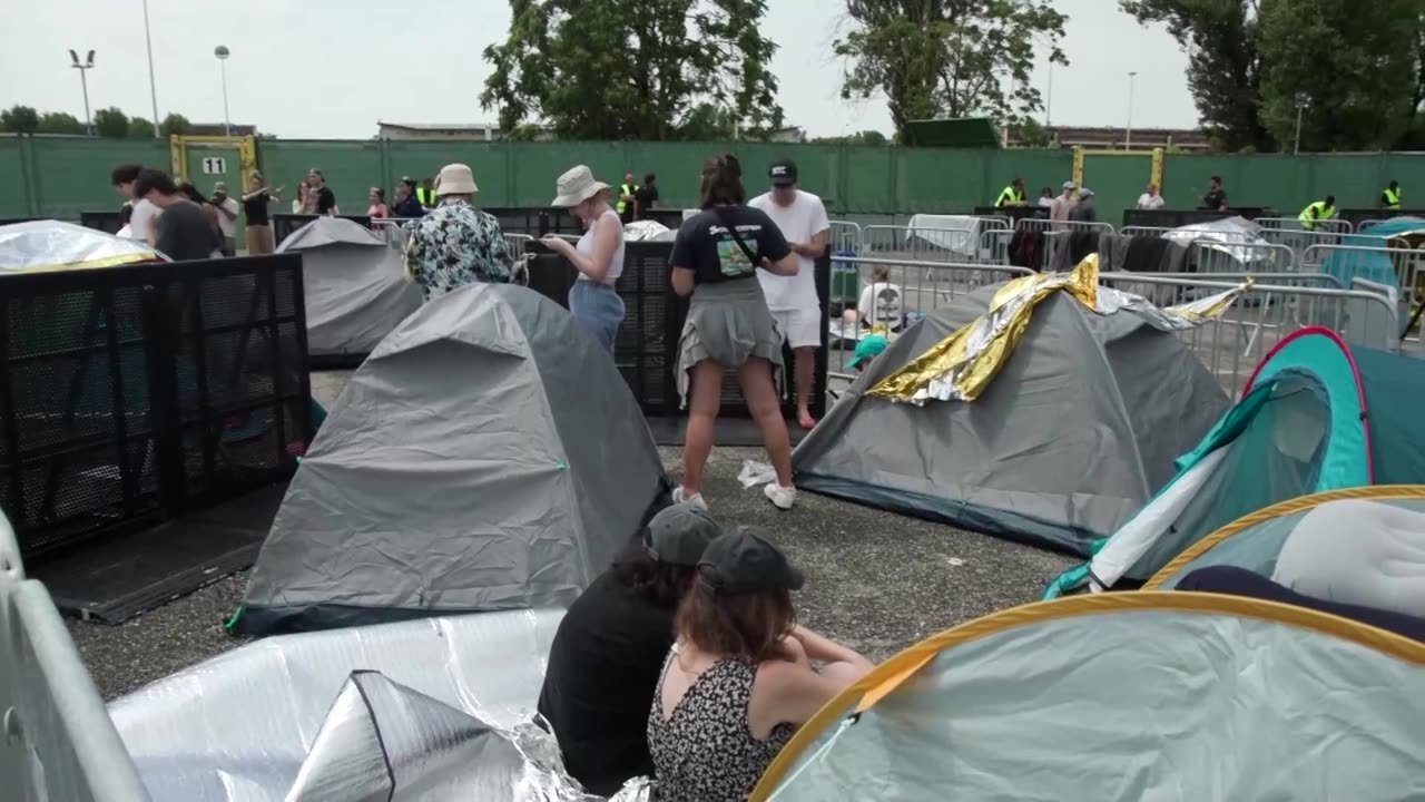 Swifties camp in tents outside stadium in Milan