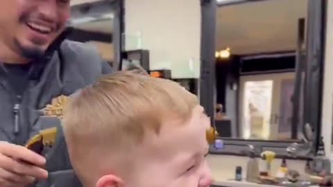 He was tickled while his hair was being cut. ❤️😂😂