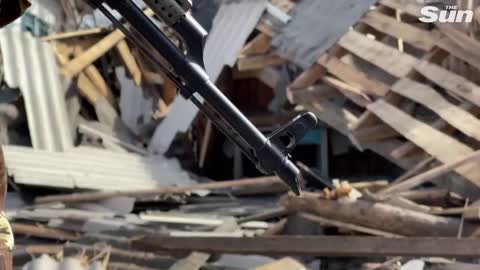 Ukrainian soldiers patrol recaptured territory near Kyiv