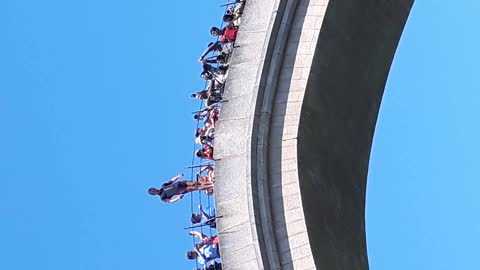 The man fell off a bridge that was 25 meters high and he survived.