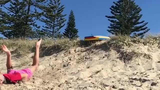 Collab copyright protection - two blonde kids face plant sand dune