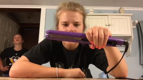 Teen Girl Figures Out She Can Pop Popcorn With Hair Straightener