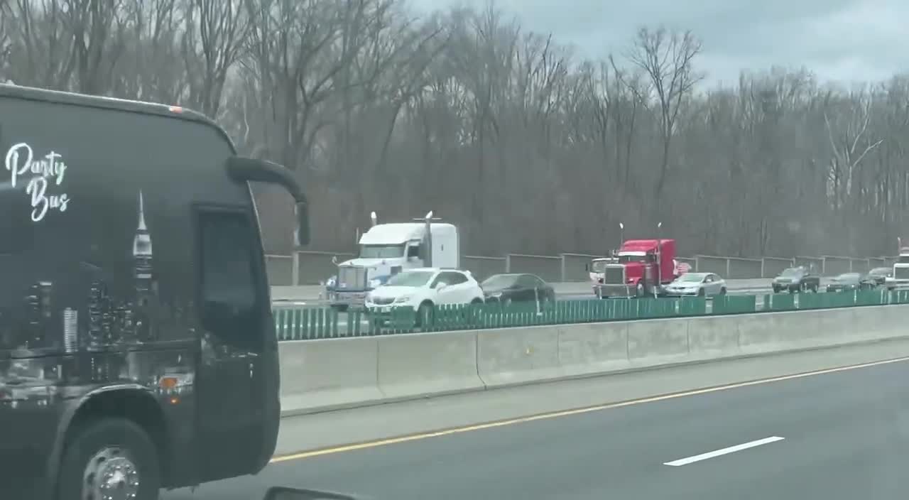 Convoy simultaneously coming around both sides of the beltway